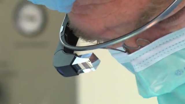 A surgeon uses Google Glass during an operation