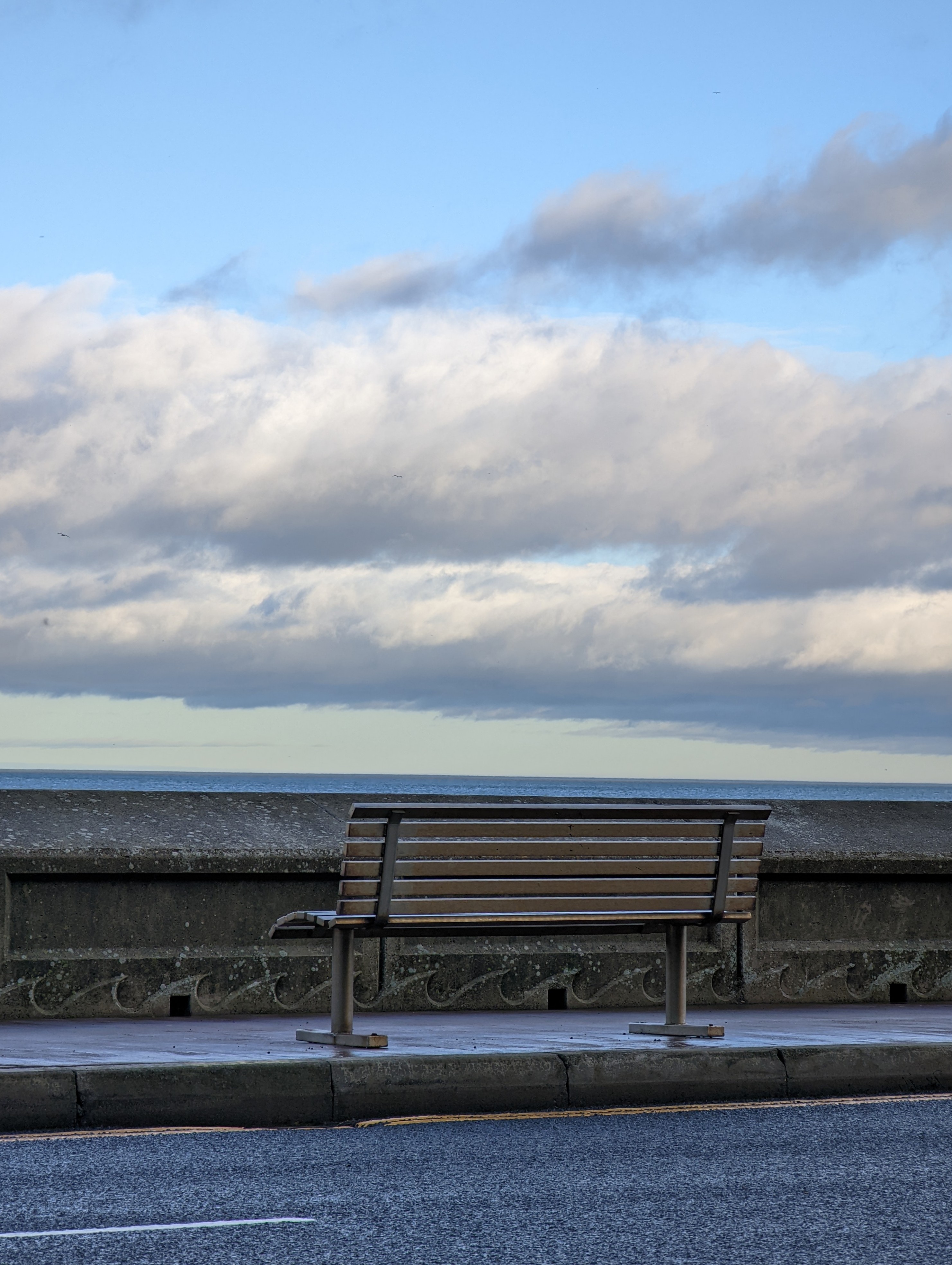 Google Pixel 6 Pro sample image of a steel bench overlooking the North Sea