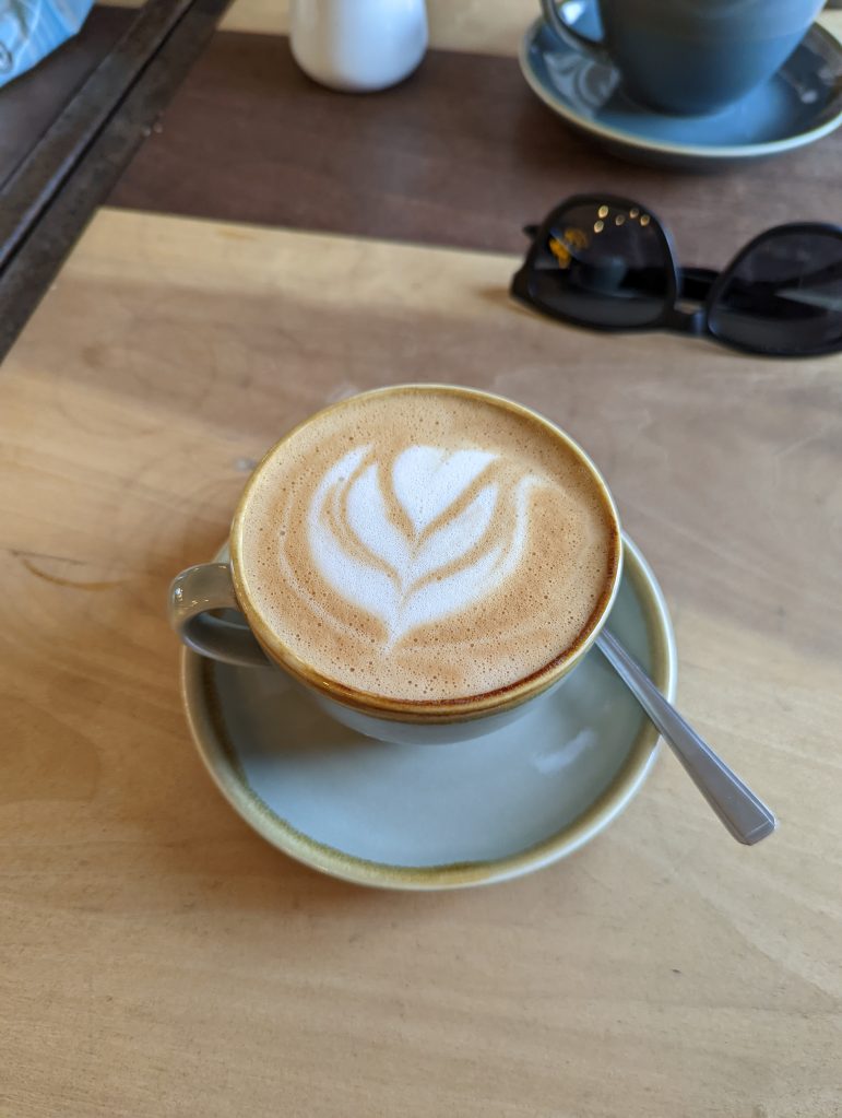 Google Pixel 6 pro sample image of tulip latte art on flat white coffee