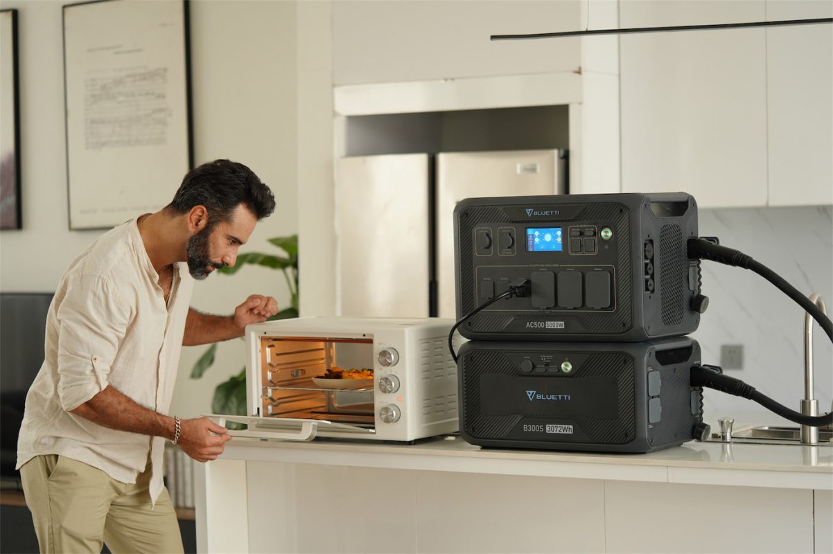 Bluetti AC500 and B300S power system being used in a kitchen to power a toaster oven