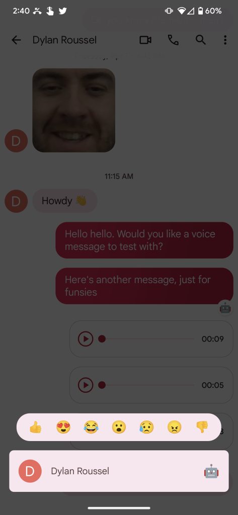 Google Messages app showing the robot emoji as a reaction