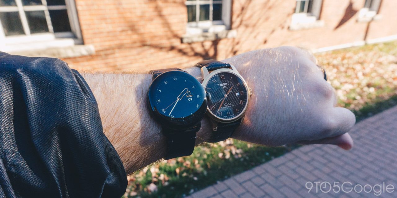 Google Pixel Watch next to a traditional luxury watch