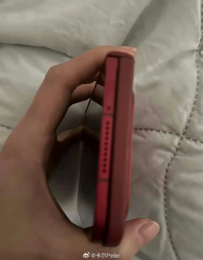 Side view of the alleged red Xiaomi 18 Fold prototype showing its folded body and hinge